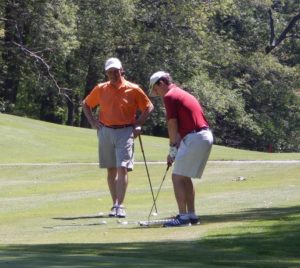 From USI Insurance Services New England: Senior Account Executive (and Gannon Golf Club member) Louis Ricci, left, of Winchester, looks on as USI Senior Vice President Paul Roberts, also of Winchester, lines up a putt at All Care’s 23rd Annual Charity Golf Open in June 2015 at Gannon Municipal Golf Course in Lynn 